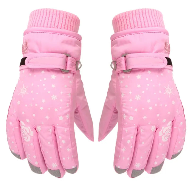 Gant de ski enfant rose pour fille avec des petites fleurs blanches. L'image est sur fond blanc.